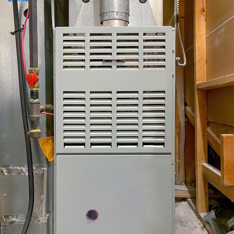 Residential furnace in the utility room by Seattle & Ballard HVAC contractor for heating service