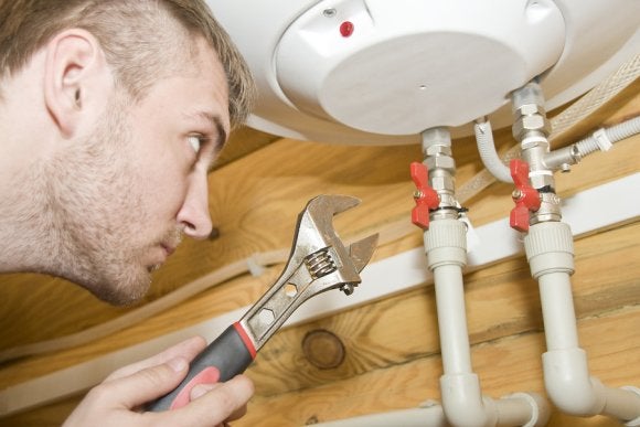 Man conducting boiler maintenance in Seattle, WA